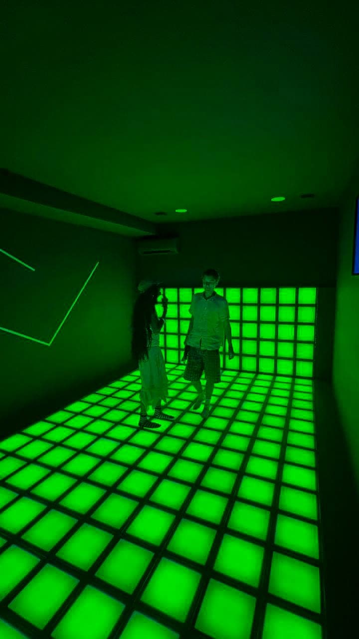 Players jumping on the interactive LED floor